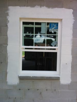 A paint-on flashing is used around the windows and doors for seamless water protection.  