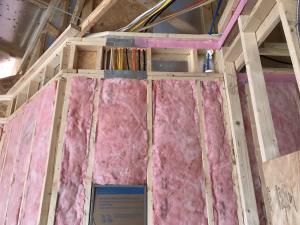 This unfaced fiberglass completely fills the wall cavities, with RESNET Grade 1 insulation. 