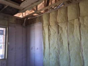 Unfaced batt and blown fiberglass wall insulation are installed to RESENET Grade 1 standards with no gaps or voids.
