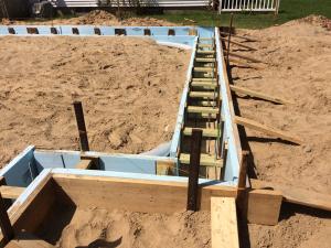 The Habitat affiliate makes its own “ICF” foundation walls with rigid foam held in place with wood spacers. 