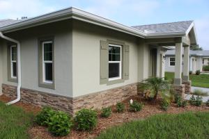 ENERGY STAR reflective roof shingles and low-SHGC windows with low-emissivity coatings help to minimize solar heat gain.