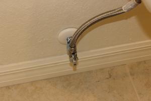 A premade gasket seals out air leaks around the water line.