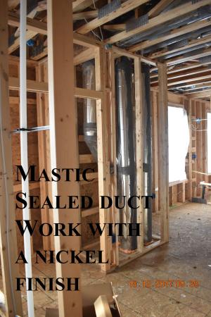 The round metal HVAC ducts are sealed with mastic at all joints and seams.