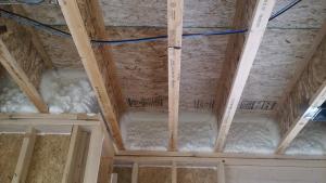 Rim joists are insulated with R-20 of open-cell spray foam which is air sealing and insulating but vapor permeable.