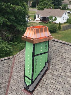Chimneys and roof valleys are flashed with metal flashing that is integrated with roof shingles.