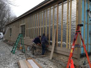 Furring strips are installed over a foil-faced rigid foam sheathing to provide a drainage plane and ventilation gap behind siding.