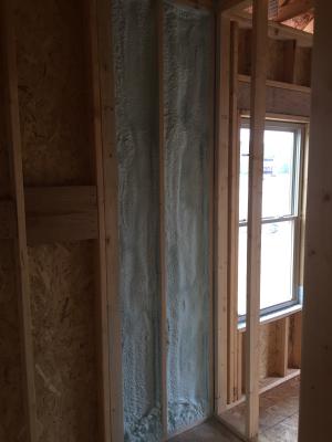 This builder installs spray foam in exterior wall cavities where tubs and showers will be installed to air seal and insulate the exterior wall. 