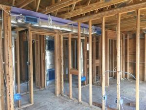 Right - Drywall was installed before installing the duct chase to ensure the ducts will be separated from the attic.