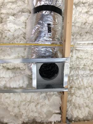 Right – Open-cell spray foam fills the attic floor joists.