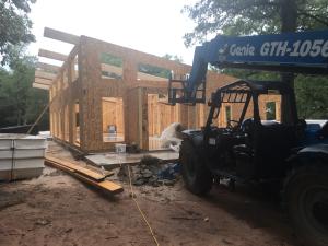Right – Structural insulated panels are quickly assembled on site for this SIP house.