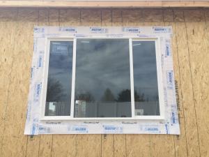 Wrong – The flashing tape was not installed with a roller to completely adhere it to the OSB sheathing surface.