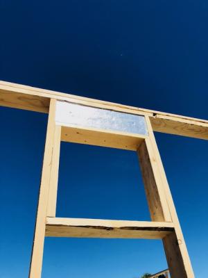 Right – Rigid foam insulation is installed in the window header.