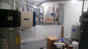Right – Space was provided next to the electric meter for home’s solar and home energy management tracking electronics.