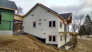 Right – A paint-on flashing was applied to the window frames of this ICF house before installing the windows.
