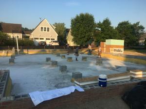 Right – Spray foam insulation was sprayed onto the ground and along the sides of the foundation walls and piers of this insulated crawl space.