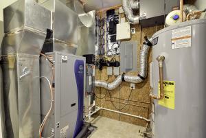 Right – A utility room provides adequate space for the home’s mechanical systems and electronic smart home monitoring equipment.