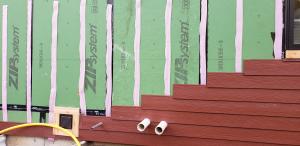 Right – Strips of foam are used to provide a ventilation gap behind the siding.