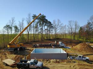 Right – Precast concrete basement walls come to the site with integrated insulation and steel-faced concrete studs.