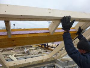 Right – A foam fabric gasket is installed in the header of this wall.