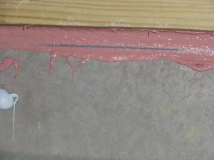 Right – The joint between the foundation wall and the mud sill is thoroughly sealed with a liquid-applied sealant.
