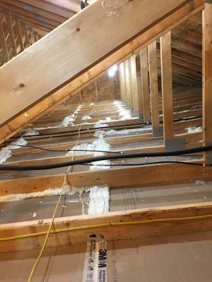 Right – The top plate-to-dry wall seams of the interior walls are sealed from the attic.