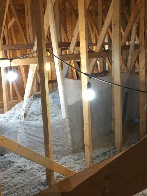 Right – Plastic tenting increases the height of the insulation above ducts that are located in the attic.