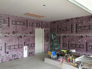Right – Every seam and nail hole in these garage-to-house walls is sealed with tape.