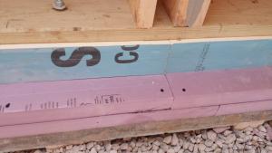 Right – R-20 of XPS and polyiso rigid foam were added on the slab shelf that is part of this precast foundation wall system. 