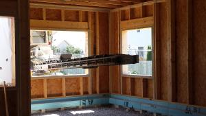 Right – Rigid foam was attached to the tops of the precast foundation walls to form an insulated edge for the floor slab.