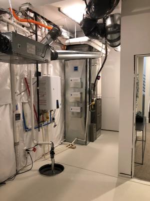 Right – The builder has provided homeowners manuals and racks to hold them on the side of the HVAC cabinet in the utility room.