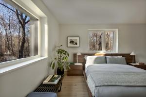 This home’s exterior walls include Larsen trusses, 9-inch I-joists attached through exterior sheathing to wall studs creating a 9-inch wall cavity that was filled with blown insulation and forms extra deep windowsills.