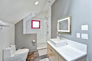 A solar tube provides more natural light while maintaining privacy for this bathroom. 