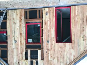Staggering sheathing seams makes it harder for moisture to infiltrate the wall to the air gap, where furring strips will allow permeating moisture to drain if needed.
