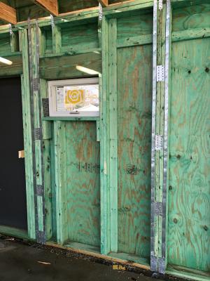 Right – Mold- and termite-resistant borate-treated lumber are used to make the panels of this kit home which are connected with metal strapping for hurricane and wind resistance. 
