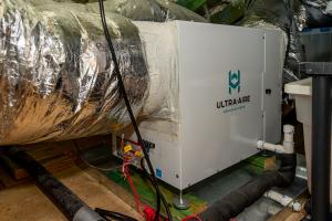 Right – A ventilating dehumidifier with a fresh air intake is tied into the central duct system of this mixed-humid climate home.