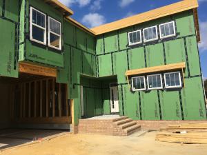 Wrong – the sheathing tape is properly installed to cover all seams in the coated sheathing but the flexible sill flashing product is not consistently installed or fully adhered around the window sills and is missing or lapped at some corners. 