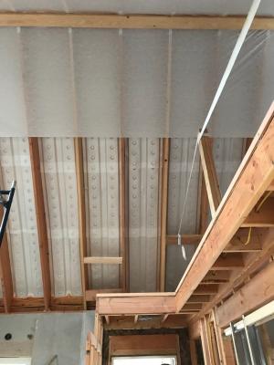 Right – Baffles are foamed in place between the roof joists of the vented, vaulted attic to direct air from the soffit vents up to the ridge vent.