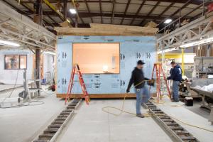 Right – This modular home is constructed in a factory where climate and ergonomic conditions can be carefully controlled. 