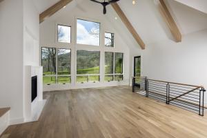 Right – The double-pane windows have low-emissivity coatings on three surfaces to reduce heat transfer through the glass allowing in views but preventing heat loss in winter and heat gain in summer.