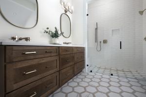 Right – The master bathroom has a handicapped-accessible shower with curbless entry and an adjustable-height hand shower.