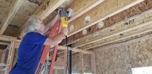 Right – Holes were drilled into the I joists between floors to run the small-diameter HRV ducts.