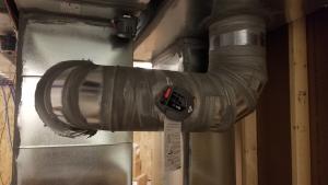 Right – This supply duct is thoroughly sealed at all joints with mastic to prevent air leakage and the duct is equipped with a damper to provide zoned heating and cooling along with other trunk ducts. 