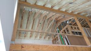 Right – Spray foam fills the roof joist cavities of this vaulted, unvented attic.