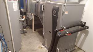 Right – This home’s HVAC system consists of a ground source heat pump that provides heating and cooling with a rated efficiency of 5.0 COP.