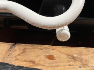 Condensation droplets are clearly seen on this uninsulated condensate line from an air conditioner located in a hot humid attic.