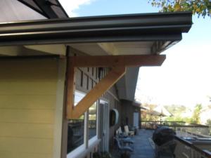 Angle support framing is added to brace a long gable overhang constructed using the ladder framing method.