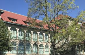 Exterior low-e storm windows were added to historic Halligan Hall on the U.S. Naval Academy campus in Annapolis, Maryland; frames were custom colored to match the existing seafoam green window trim