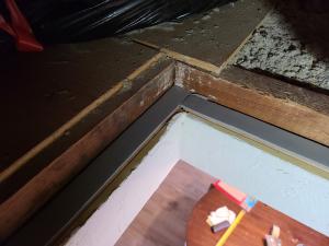 Weatherstripping has been installed along the framing of this attic access panel to air seal the opening.