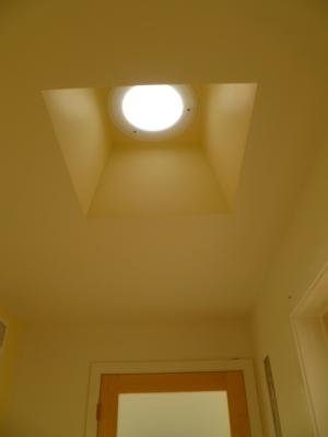 Light tubes are installed in hallways and closets to bring natural daylight into the home, even in areas that do not have direct windows. 
