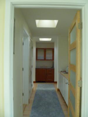 Solar tubes are installed in the hallway to bring sunlight into the interior of the home.